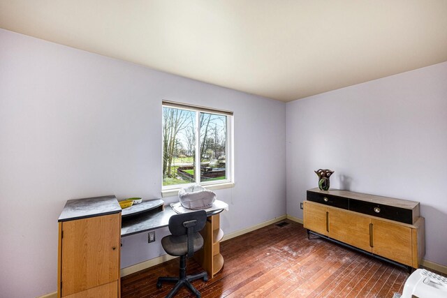 home office with baseboards and wood-type flooring