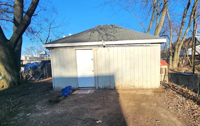 view of shed with fence