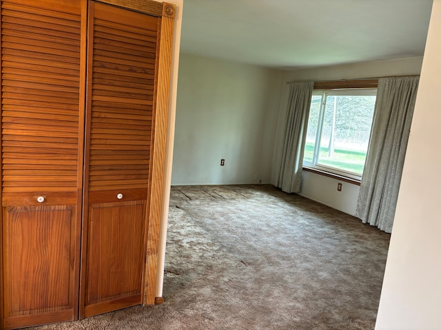 8233 Farrand Rd, Otisville, MI 48463 - unfurnished bedroom featuring carpet floors and a closet