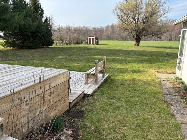 8233 Farrand Rd, Otisville, MI 48463 - view of yard with a deck, an outdoor structure, and a shed
