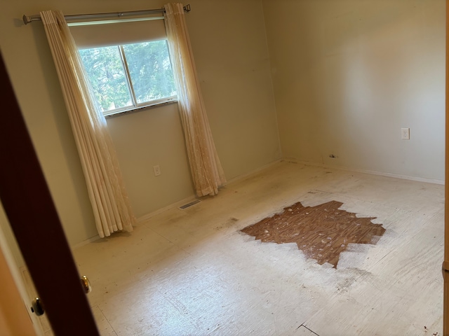 8233 Farrand Rd, Otisville, MI 48463 - unfurnished room featuring baseboards