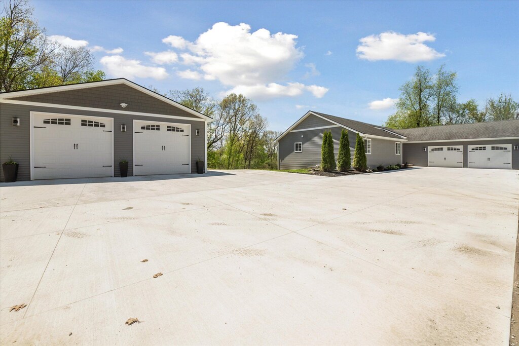 2892 Beck Rd, Howell, MI 48843 - view of home's exterior with a detached garage