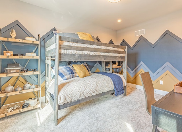 bedroom with baseboards, carpet, and visible vents