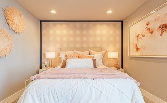 bedroom with carpet floors, baseboards, and recessed lighting