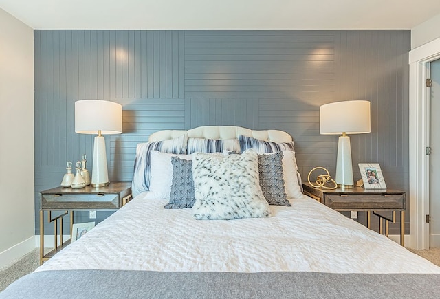 bedroom with baseboards and carpet floors