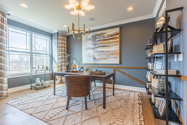dining room with baseboards, an inviting chandelier, recessed lighting, crown molding, and wood finished floors