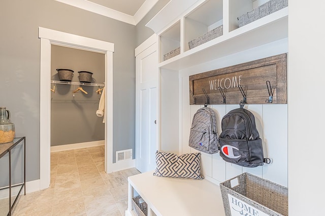 mudroom featuring ornamental molding and visible vents