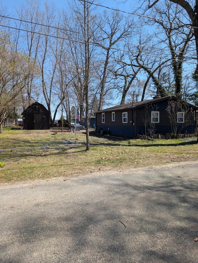 exterior space with a storage unit and an outbuilding