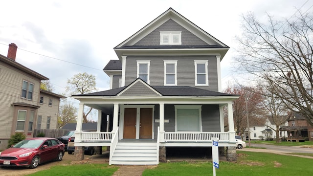 320 W Vine St, Kalamazoo, MI 49001 - view of front facade featuring a porch and a front yard