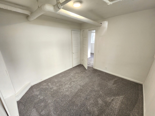 320 W Vine St, Kalamazoo, MI 49001 - empty room featuring baseboards and dark carpet