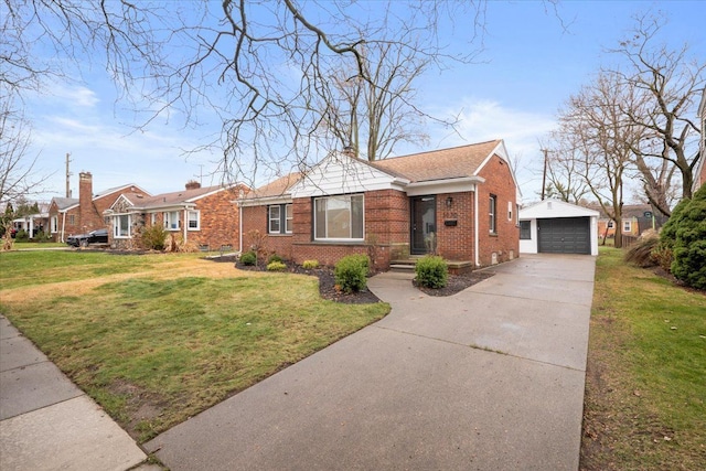 view of front of property featuring a garage, an outdoor structure, a front lawn, brick siding, and concrete driveway