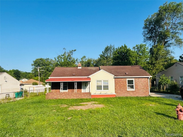 25590 Middlebelt Rd, Flat Rock, MI 48134 - back of property featuring brick siding and a chimney
