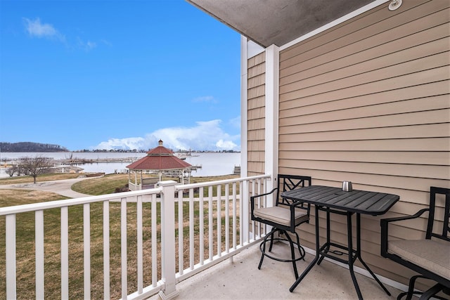 balcony featuring a water view