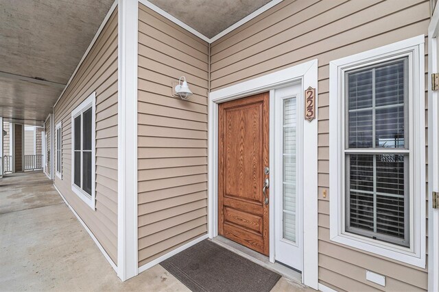 property entrance featuring covered porch