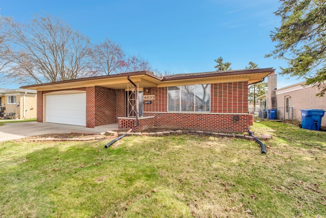 single story home featuring concrete driveway, a garage, a front yard, and brick siding