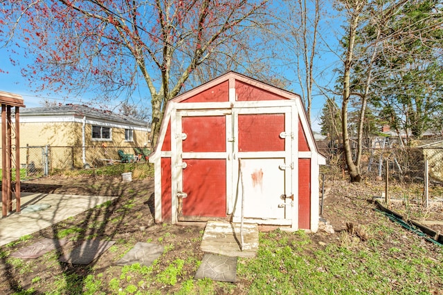 view of shed with fence