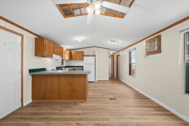 22600 Middlebelt Rd Lot F-28, Farmington Hills, MI 48336 - kitchen featuring a peninsula, freestanding refrigerator, ornamental molding, and lofted ceiling