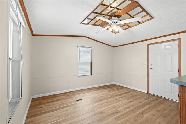 22600 Middlebelt Rd Lot F-28, Farmington Hills, MI 48336 - empty room with baseboards, vaulted ceiling, crown molding, a ceiling fan, and light wood-style floors