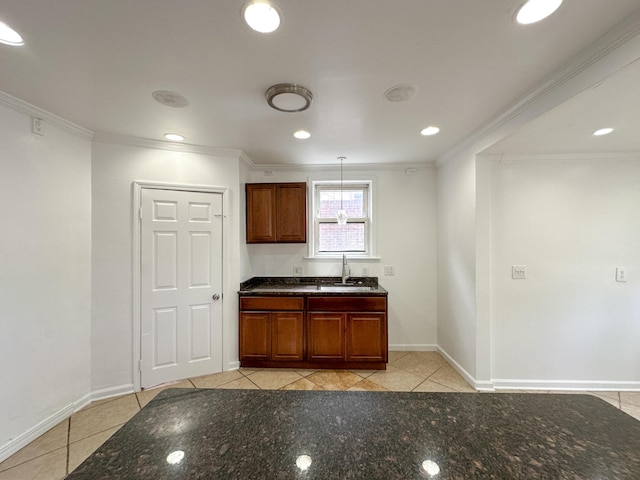 16575 Mendota St, Detroit, MI 48221 - kitchen with light tile patterned floors, a sink, ornamental molding, and dark stone countertops