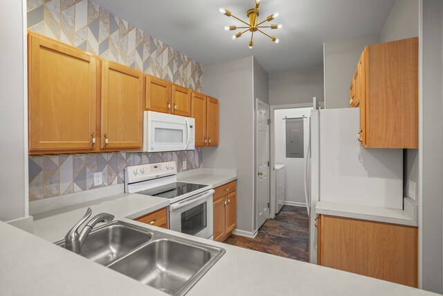 10025 Sunrise Dr, Grand Blanc, MI 48439 - kitchen with white appliances, a chandelier, light countertops, tasteful backsplash, and electric panel