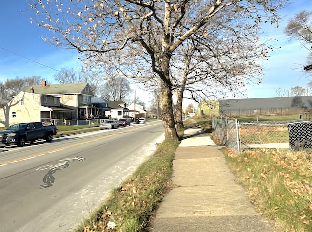 view of street featuring a residential view and sidewalks