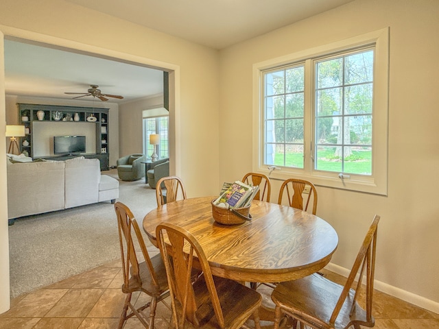 2126 Holly Tree Dr, Davison, MI 48423 - dining space featuring baseboards, ceiling fan, and light colored carpet