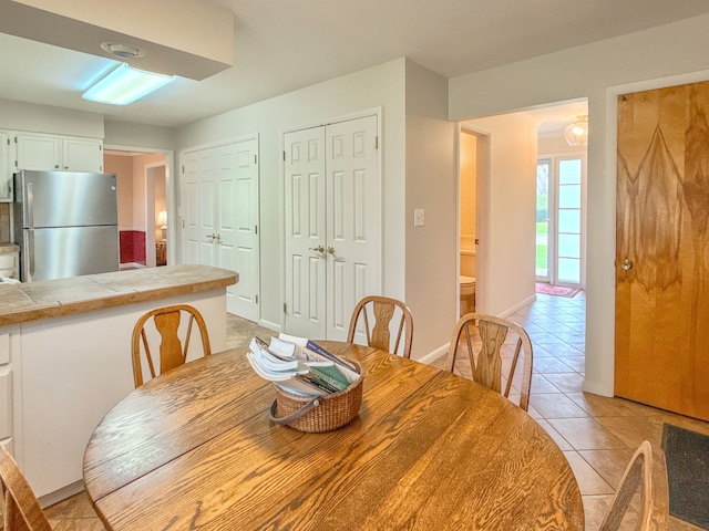 2126 Holly Tree Dr, Davison, MI 48423 - dining room featuring light tile patterned floors and baseboards