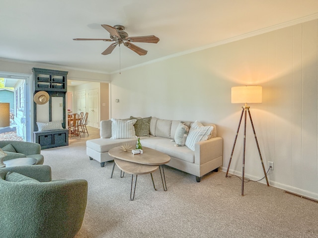 2126 Holly Tree Dr, Davison, MI 48423 - carpeted living area featuring ceiling fan, crown molding, and baseboards