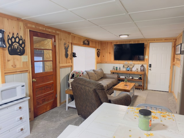 10953 Johnston Blvd, Saint Helen, MI 48656 - living room with wooden walls and light colored carpet