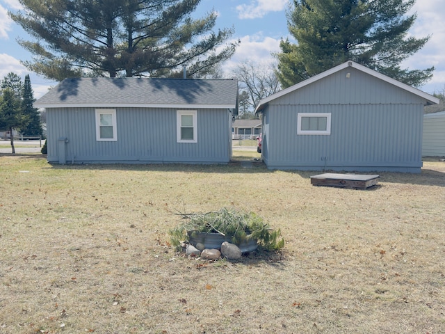 10953 Johnston Blvd, Saint Helen, MI 48656 - view of property exterior featuring a yard and a shingled roof