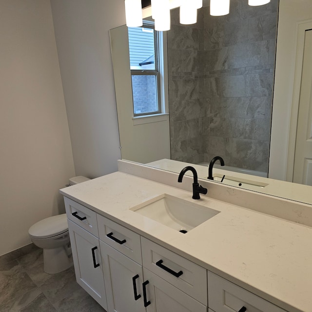 bathroom with vanity and toilet