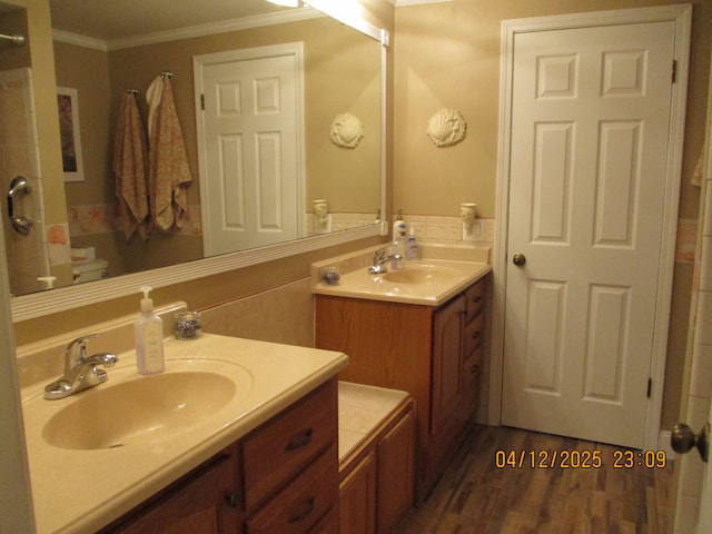 14879 Riverside St, Livonia, MI 48154 - full bathroom featuring ornamental molding, vanity, and wood finished floors