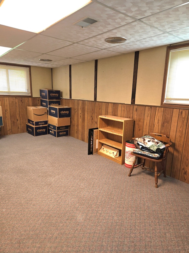 14879 Riverside St, Livonia, MI 48154 - living area featuring wood walls, carpet flooring, wainscoting, and a drop ceiling