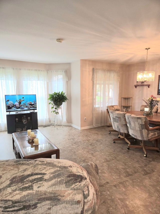 14879 Riverside St, Livonia, MI 48154 - living room featuring a chandelier and plenty of natural light