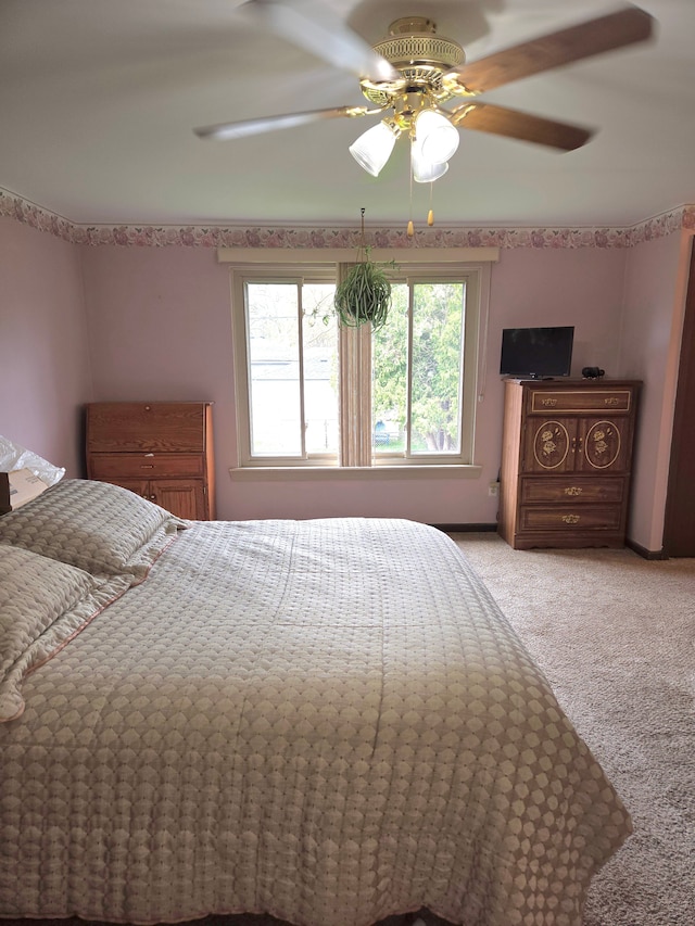 14879 Riverside St, Livonia, MI 48154 - bedroom with light colored carpet and a ceiling fan