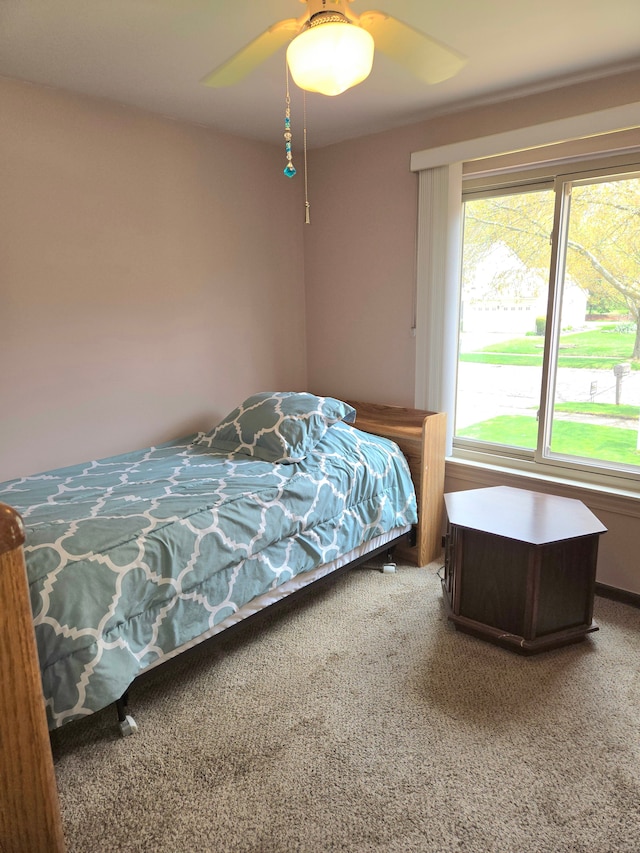 14879 Riverside St, Livonia, MI 48154 - carpeted bedroom with a ceiling fan