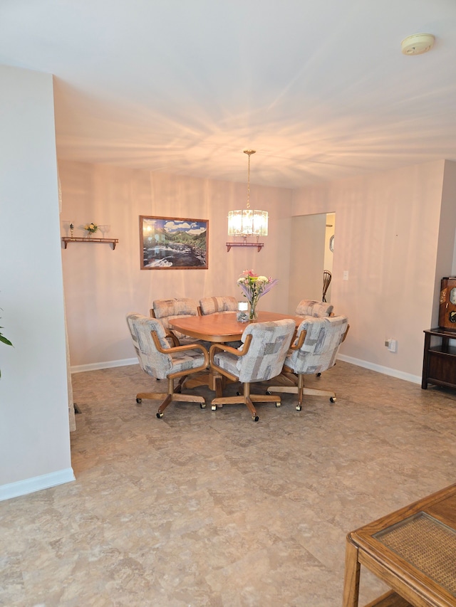 14879 Riverside St, Livonia, MI 48154 - dining area featuring baseboards and a chandelier