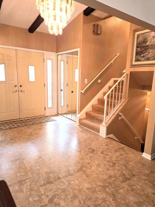 14879 Riverside St, Livonia, MI 48154 - foyer entrance featuring tile patterned floors, a chandelier, and stairs