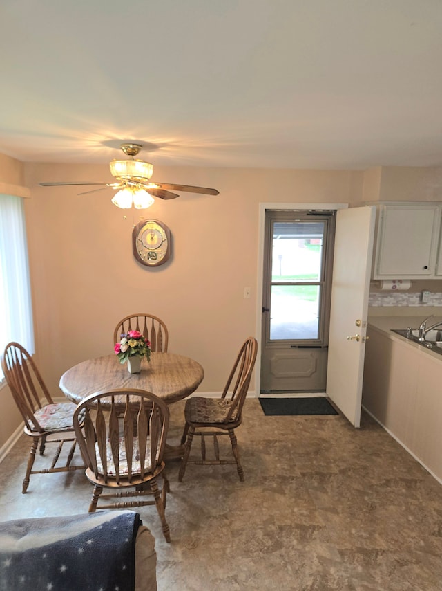 14879 Riverside St, Livonia, MI 48154 - dining area with ceiling fan and baseboards