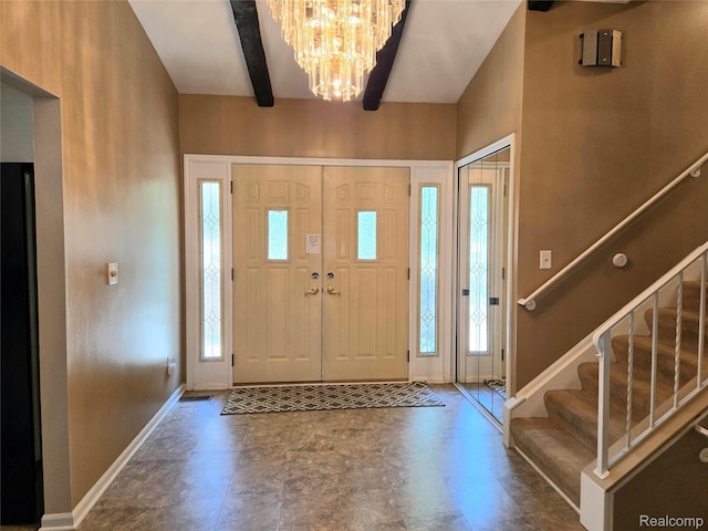 14879 Riverside St, Livonia, MI 48154 - foyer entrance featuring healthy amount of natural light, a chandelier, stairway, and beam ceiling