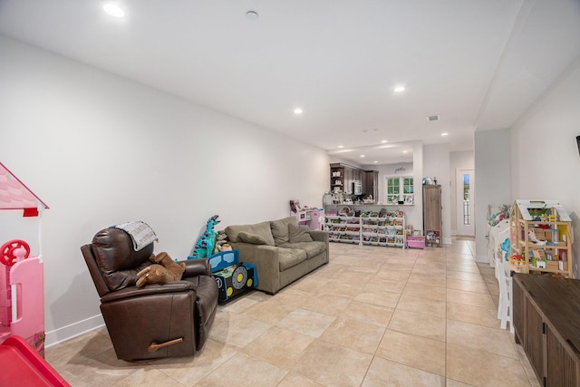 living room featuring recessed lighting and light tile patterned flooring