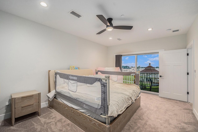 bedroom featuring access to exterior, visible vents, baseboards, and carpet