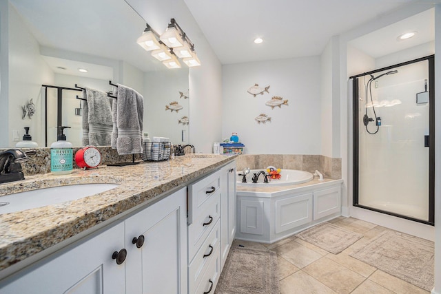 full bathroom with a stall shower, a garden tub, double vanity, and a sink