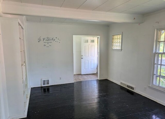 2557 Tiffin St, Flint, MI 48504 - empty room with crown molding, wood finished floors, and baseboards