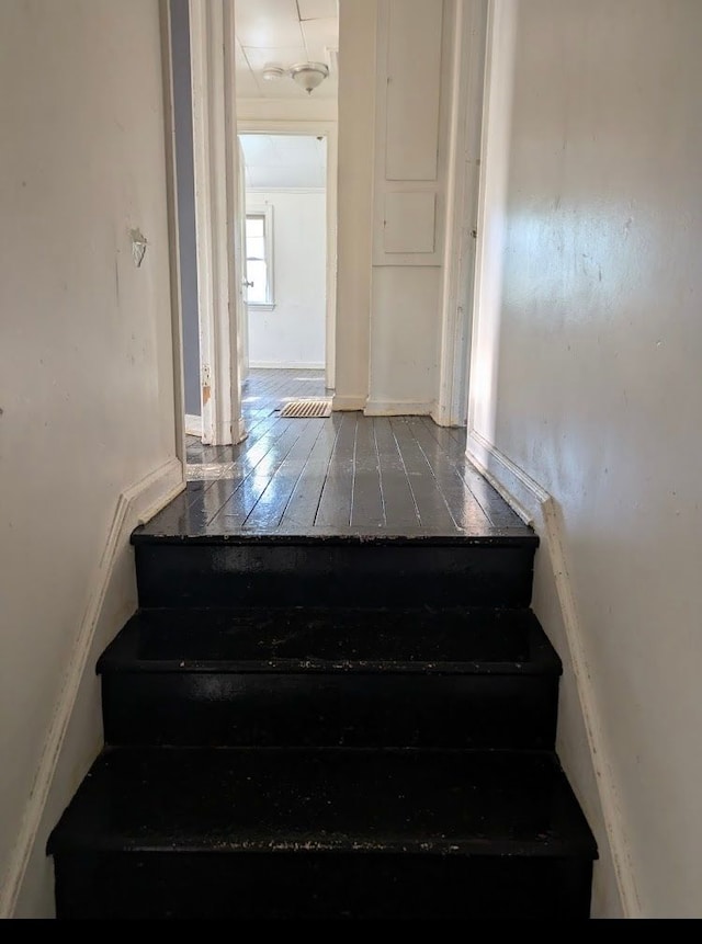 2557 Tiffin St, Flint, MI 48504 - stairs featuring wood-type flooring
