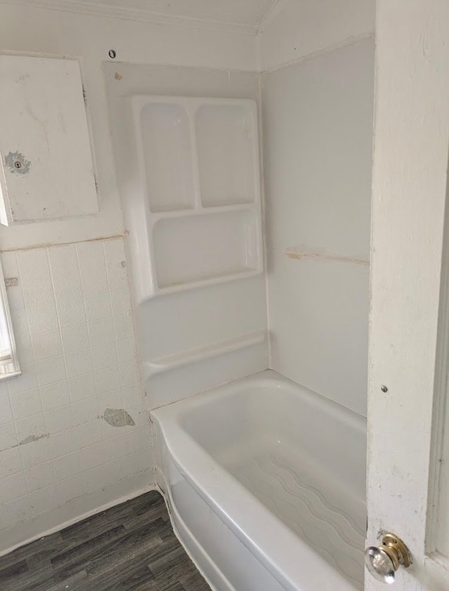 2557 Tiffin St, Flint, MI 48504 - full bath featuring wood finished floors, a tub, and a shower
