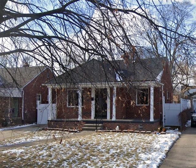 ranch-style house with brick siding and covered porch