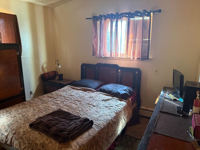 bedroom featuring baseboard heating