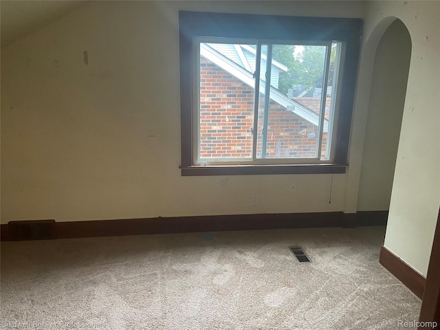 22106 Avalon St, Saint Clair Shores, MI 48080 - carpeted spare room with arched walkways and baseboards