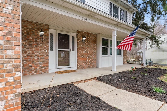 3715 W Hiawatha Dr, Okemos, MI 48864 - property entrance featuring a porch and brick siding